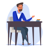 A school principal with glasses and a beard is sitting at a desk, with a stack of books in front of them, working on learning materials.